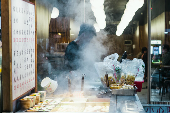 Food stall with steam at the night market, Taipei, Taiwan