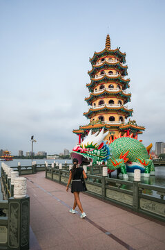 Asian tourist visiting the Dragon and Tiger Pagodas at Lotus Pond in Kaohsiung, Taiwan