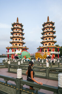 Asian tourist at Dragon and Tiger pagodas, Zuoying, Kaohsiung, Taiwan