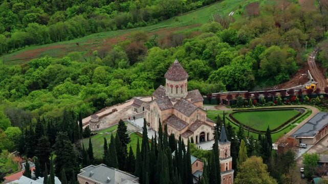 Cinematic aerial footage of Bodbe Monastery showcasing its historic Orthodox architecture surrounded by peaceful Georgian landscapes.
