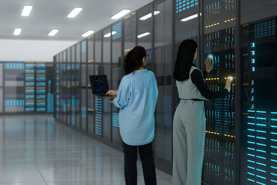 3D data center team inspects server panel with laptop