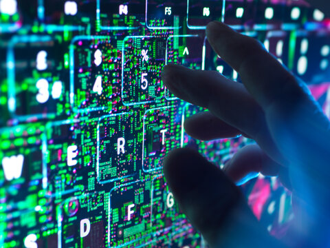 Hand typing on futuristic AI keyboard with cybersecurity concept