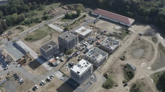 Aerial view of the construction site in Bessungen with multi-story buildings under development and a crane in Darmstadt, Hessen, Germany.