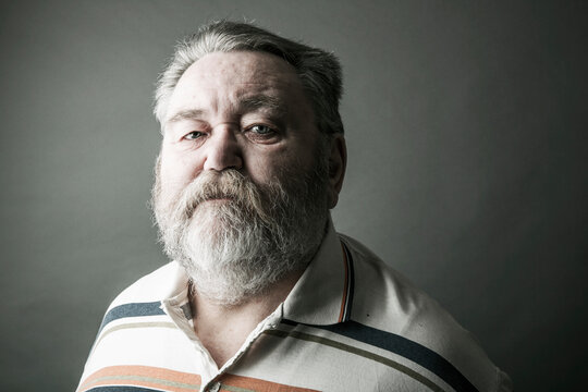 Portrait of senior man with full beard