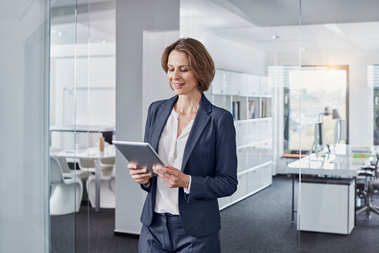 Businesswoman using tablet in office