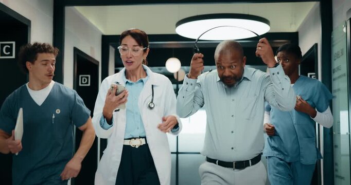 People, doctor and rushing with team in hospital hallway for medical procedure or operation. Group, healthcare workers or emergency run with alert or protocol for health support or ICU in corridor