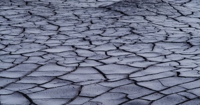 Be captivated by the delicate artistry of cracked, dry soil in this beautiful video. The unique formations showcase the effects of weather extremes and the urgent need for environmental preservation.