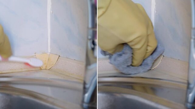 Gloved hand demonstrates grout cleaning before and after, toothbrush scrubbing corner seam by sink then wiping to reveal lighter tile edge, instructional domestic cleaning clip