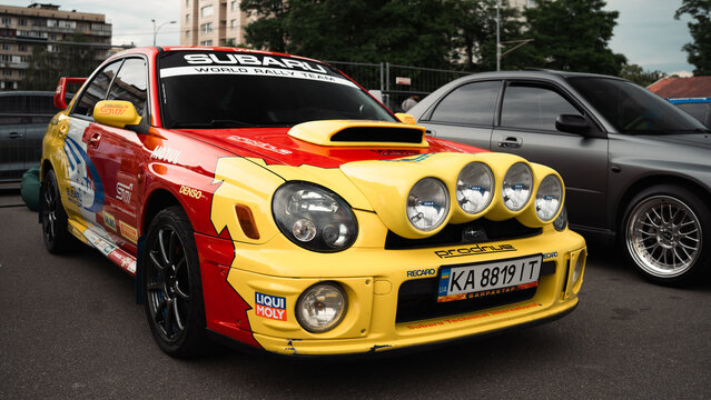 Ukraine, Kyiv - 20 October 2023. Kyiv Car Fest. Brightly colored Subaru Impreza WRX STI, adorned with a rally themed livery
