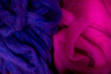 Pink and blue wool fleece illuminated with colorful light effects © were