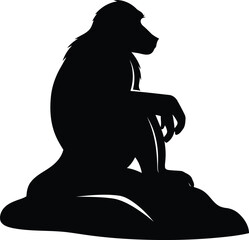 Black silhouette of a monkey sitting on a rock © Nasrin