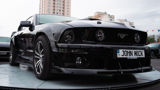 Kyiv, Ukraine - October 20, 2023. A black Ford Mustang was displayed at Kyiv Car Fest, an automotive exhibition featuring custom, sports, and collector cars in Kyiv.