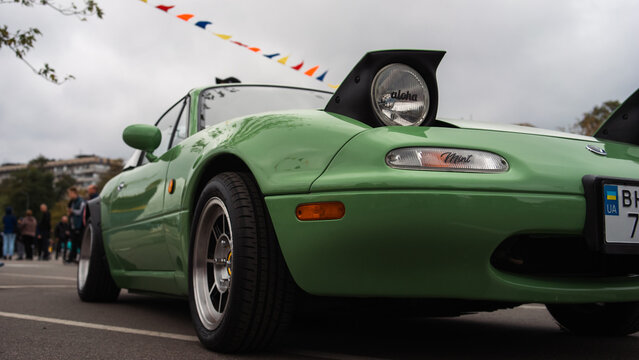 Kyiv, Ukraine - October 20, 2023. A green Mazda MX-5 Miata roadster was displayed outdoors at Kyiv Car Fest, an automotive event featuring modified, classic, and collector vehicles.