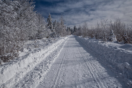 Hiking trail to Velka Cantoryje hill summit in winter Slezske Beskydy mountains in Czech republic