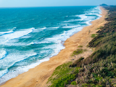 aerial view of waves on the beach