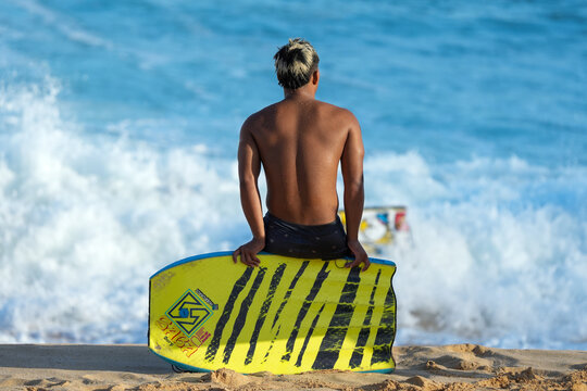 Hubboards brand bodyboard showcased in this tropical surf photo