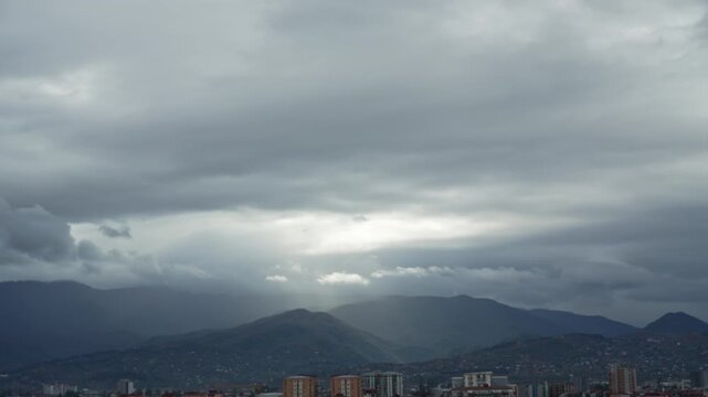 Panning vew of the city near Georgian mountains, moving clouds before thunderstorm. Batumi city life timelapse. Adjara, Batumi timelapse