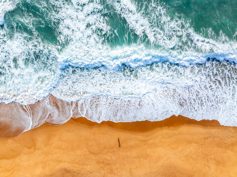 aerial view of waves on the beach
