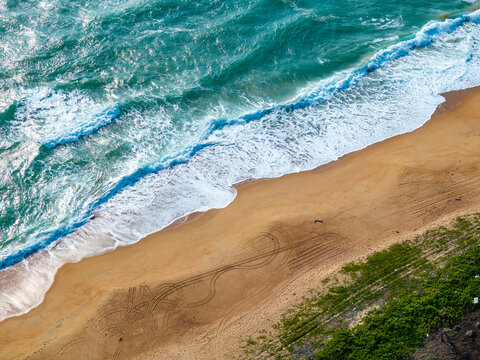 aerial view of waves on the beach