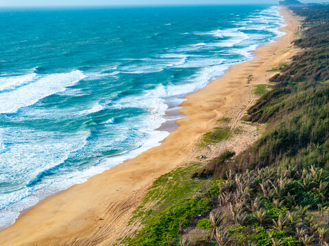 aerial view of waves on the beach