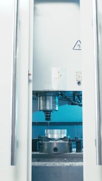 Door open to CNC milling machine making product
