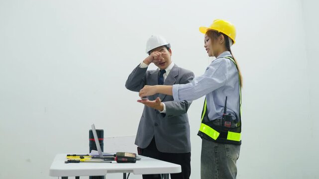 Business meeting construction engineer worker hard hat safety vest office planning teamwork discussion blueprint site collaboration professional strategy project table laptop presentation