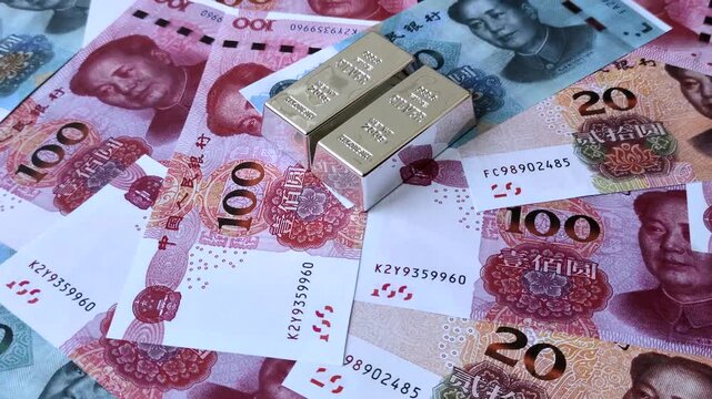 A silver bar, white metal against a backdrop of Chinese money, as a concept for the sales market. A silver bar as a background for your design