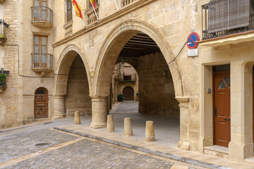 Fototapeta premium Spain square in the Historic center of the beautiful village of Calaceite with the typical stone houses. Teruel, Aragon, Spain.