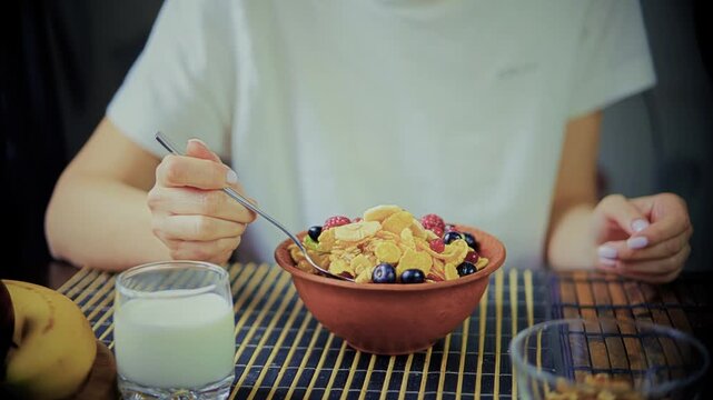 Person Eating Healthy Breakfast Cornflakes With Fresh Berries. Vegetarian Morning Meal 