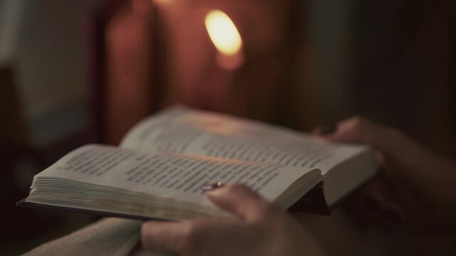 Woman Pointing At Sacred Text Scripture Book In Atmospheric Room. Evening Prayer. Christian Ritual