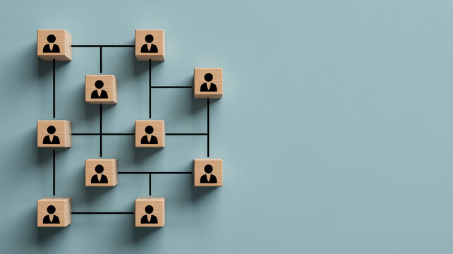Wooden cubes with silhouette icons of people are interconnected by black lines, illustrating a network structure and organizational chart.