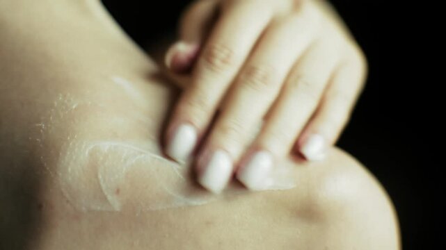 Hand Applying Moisturizing Cream. Smearing Cosmetic Lotion Body Skin Care Routine. Treatment Hydration Dermatological Wellness Beauty Therapy Procedure