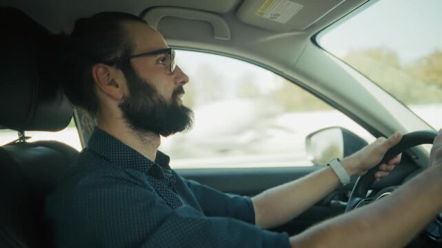 Driver Steering Automobile Looking Ahead At Road. Vehicle Owner Traveling By Machine. Commuting Trip Journey 