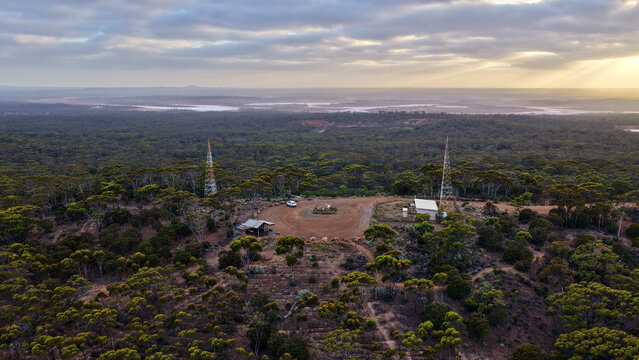 Beacon Lookout, Norseman, Western Australia &ndash; 4K Aerial Drone Footage of Outback Forest, Remote Wilderness, Communication Towers and Golden Sunset Sky near Dundas