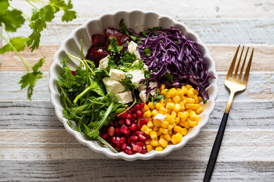  Salad bowl with red cabbage, beetroot, sweetcorn and pomegranate