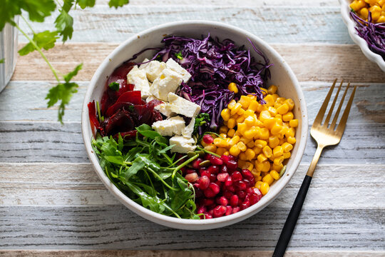 Salad bowl with red cabbage, beetroot, sweetcorn and pomegranate