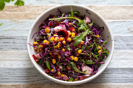 Salad bowl with red cabbage, beetroot, sweetcorn and pomegranate