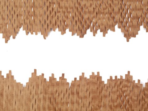 Brown honeycomb paper bubble wrap frame with white background copy space. Perfect eco-friendly packaging background concept