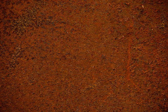 Rusty Metal Texture Background. Detailed grunge background featuring oxidized steel in warm brown and orange tones, ideal for design overlays, posters, backgrounds, and industrial themed projects.
