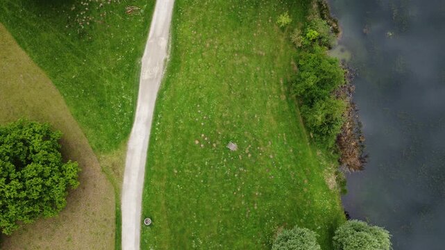 Aerial view of path, lake, and nature
