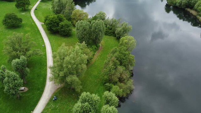 Aerial view of path, lake, and nature