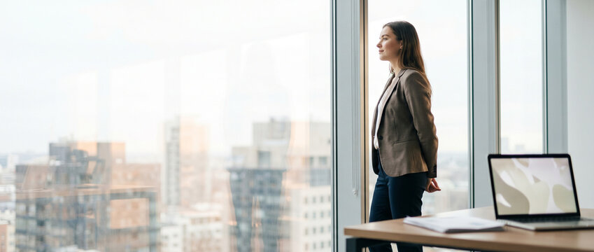 Professional taking a window break to reset focus