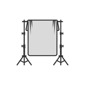 A photographic backdrop stand holds a plain gray cloth, ready for studio shoots or filming.