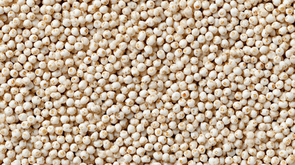 Fototapeta premium Macro background of pale ivory Israeli pearl couscous grains piled loosely across the frame