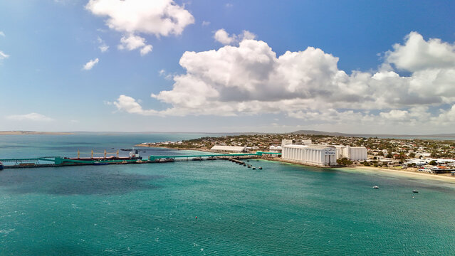 Port Lincoln, South Australia &ndash; 4K aerial drone view of coastal city, jetty, turquoise bay, beachfront, marina, suburban houses, residential estates and Eyre Peninsula shoreline