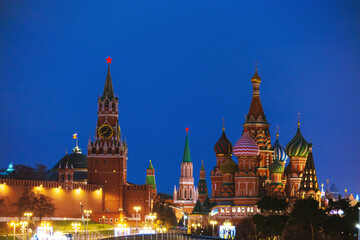 Fototapeta premium The Spasskaya Tower and St. Basil's Cathedral. The main symbols of Moscow at night.