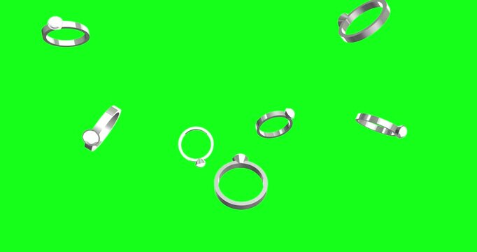 Elegant silver engagement and wedding rings, some sparkling, gracefully fall against a vibrant green screen. This versatile animation is perfect for romantic projects and easy chroma keying.