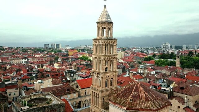 Cinematic aerial drone footage of Split featuring the Adriatic coastline, historic old town, marina, and Mediterranean atmosphere. Ancient architecture mixed with modern coastal life