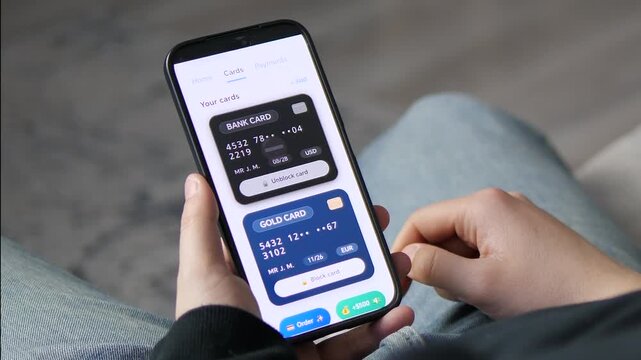 Viewing a banking app dashboard with a balance of 14,280 dollar. The screen displays a Bank Card and Gold Card with options to block or unblock. Perfect for fintech, digital wallets, and personal
