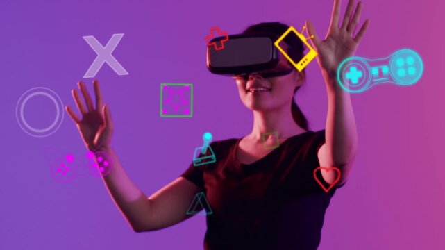 Woman using VR raising hands, moving neon gaming icons aligning on visor showing tech for creators